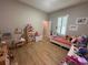 Playful ' bedroom with light walls, organized toys, and a bright, cheerful atmosphere at 9863 Summerlake Groves St, Winter Garden, FL 34787