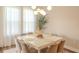 Bright dining room with an elegant table and chairs under a chandelier at 9863 Summerlake Groves St, Winter Garden, FL 34787
