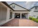 Two-car garage with brick paver driveway for a contemporary home in a suburban neighborhood at 9863 Summerlake Groves St, Winter Garden, FL 34787