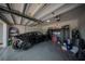 Well organized garage with epoxy floors, overhead storage, and lots of space for cars and other equipment at 9863 Summerlake Groves St, Winter Garden, FL 34787