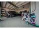 Spacious two car garage with epoxy floors, overhead storage, and tons of room for storage at 9863 Summerlake Groves St, Winter Garden, FL 34787