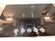 Close-up of a KitchenAid cooktop with sleek black glass and precise temperature controls at 9863 Summerlake Groves St, Winter Garden, FL 34787