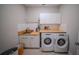 Laundry room with sink, washer, dryer, and built-in cabinets at 9863 Summerlake Groves St, Winter Garden, FL 34787