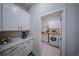Well-lit laundry room with modern appliances and ample counter space at 9863 Summerlake Groves St, Winter Garden, FL 34787