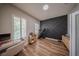 Bright office space with modern desk, treadmill and hardwood floors at 9863 Summerlake Groves St, Winter Garden, FL 34787