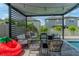Outdoor patio featuring stylish seating, a cozy fire pit, and a pergola draped with charming string lights at 9863 Summerlake Groves St, Winter Garden, FL 34787