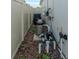 The pool equipment is located on the side of the house and is surrounded by a privacy fence at 9863 Summerlake Groves St, Winter Garden, FL 34787