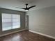 Serene bedroom featuring modern ceiling fan, wood-look floors, and a relaxing atmosphere at 9923 Dean Acre Dr, Orlando, FL 32825