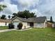 Charming single-story home with well-maintained lawn and attached garage at 9923 Dean Acre Dr, Orlando, FL 32825