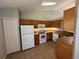Efficient kitchen boasting classic cabinets, appliances, and ample counter space at 9923 Dean Acre Dr, Orlando, FL 32825