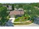 Aerial view of a single-Gathering home with a well-maintained yard at 10018 Chesham Dr, Orlando, FL 32817