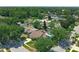 An aerial shot of a neighborhood with mature trees and houses at 10018 Chesham Dr, Orlando, FL 32817