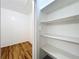 View of two closets, one walk-in and one with shelving at 10018 Chesham Dr, Orlando, FL 32817