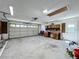 Spacious garage offering ample parking and storage space, ideal for vehicles and household items at 10018 Chesham Dr, Orlando, FL 32817