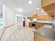 Charming eat-in kitchen showcasing tile floors, classic cabinetry, and modern appliances at 10018 Chesham Dr, Orlando, FL 32817