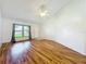 Spacious living room with wood floors, ample natural light, and a high vaulted ceiling at 10018 Chesham Dr, Orlando, FL 32817