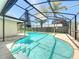 The screened-in pool area provides a refreshing escape, perfect for relaxation and entertainment at 10018 Chesham Dr, Orlando, FL 32817