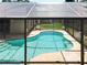 The screened-in pool offers a private oasis for relaxation and enjoying the outdoors in comfort at 10018 Chesham Dr, Orlando, FL 32817