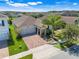 Beautiful aerial view of a single-Gathering home featuring a brick driveway and manicured lawn at 10091 Lovegrass Ln, Orlando, FL 32832