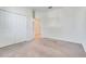 The bedroom features neutral carpet, a closet with folding doors, and white walls at 10091 Lovegrass Ln, Orlando, FL 32832