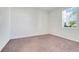 The bedroom features neutral carpet, a window with blinds, and white walls at 10091 Lovegrass Ln, Orlando, FL 32832