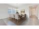 Elegant dining room with a chandelier and tile flooring, perfect for Gathering gatherings and entertaining guests at 10091 Lovegrass Ln, Orlando, FL 32832