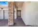 Inviting front entrance featuring a brick-paved walkway and a striking stone pillar accent at 10091 Lovegrass Ln, Orlando, FL 32832