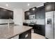 Stylish kitchen featuring granite countertops, stainless steel appliances, and chic backsplash at 10091 Lovegrass Ln, Orlando, FL 32832