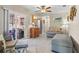 Open-concept living room flowing into kitchen with sliding glass door to screened patio at 109 Woodfield Ct, Sanford, FL 32773
