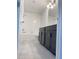 Clean bathroom featuring tile flooring, a vanity, and shower with white tile surround at 11070 Longleaf Woods Dr, Orlando, FL 32832