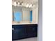 Modern bathroom with double sinks, stylish lighting, and sleek vanity at 11070 Longleaf Woods Dr, Orlando, FL 32832