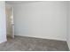 Neutral carpeted bedroom with a door to the hallway at 11070 Longleaf Woods Dr, Orlando, FL 32832