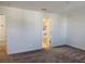 Spacious bedroom with neutral carpeting, white walls, and an en-suite bathroom view featuring a tub and shower at 11070 Longleaf Woods Dr, Orlando, FL 32832