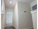 Bright hallway with carpeted floors and white walls leading to the bedrooms at 11070 Longleaf Woods Dr, Orlando, FL 32832