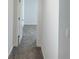 View down the hallway to a bedroom with carpet at 11070 Longleaf Woods Dr, Orlando, FL 32832