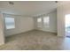 Bright, open living room with tile flooring, large windows, and a welcoming atmosphere at 11070 Longleaf Woods Dr, Orlando, FL 32832