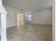 Spacious living room with neutral tile flooring and ample natural light at 11070 Longleaf Woods Dr, Orlando, FL 32832