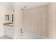 The bathroom includes a tiled shower with a tub and a sink with a vanity at 12 Horseman Cv, Longwood, FL 32750
