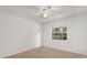 Bedroom with a ceiling fan and window that provides plenty of natural light at 12 Horseman Cv, Longwood, FL 32750