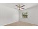 Bedroom with a ceiling fan and window that provides plenty of natural light at 12 Horseman Cv, Longwood, FL 32750