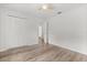 This is a bedroom with wood floors and closet at 12 Horseman Cv, Longwood, FL 32750
