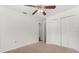 Bedroom with carpet, a ceiling fan, and a large closet for storage at 12 Horseman Cv, Longwood, FL 32750