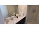 This bathroom features a double vanity with a modern countertop and elegant fixtures at 1201 Challenge Dr, Davenport, FL 33896