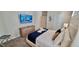 Comfortable bedroom featuring a TV, dresser, and plush carpeting at 1201 Challenge Dr, Davenport, FL 33896