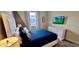 Comfortable bedroom with a queen-sized bed and stylish decor at 1201 Challenge Dr, Davenport, FL 33896