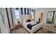 Bright bedroom with blue accent wall, plush carpeting, and a large comfortable bed at 1201 Challenge Dr, Davenport, FL 33896