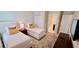 This charming bedroom features two twin beds, closet, and a modern TV for relaxing after a long day at 1201 Challenge Dr, Davenport, FL 33896