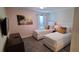 Comfortable bedroom featuring two twin beds, a TV, and plush carpeting at 1201 Challenge Dr, Davenport, FL 33896