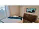 Neat bedroom with a TV, dresser, and plush carpeting at 1201 Challenge Dr, Davenport, FL 33896