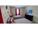 This Disney-themed bedroom boasts two twin beds and a TV mounted on the wall at 1201 Challenge Dr, Davenport, FL 33896